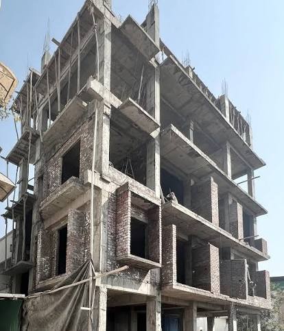 Small building under construction with brick and RCC framing